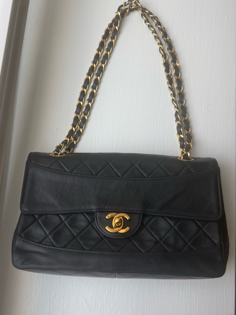 CHANEL Black Quilted Leather Shoulder Bag with Gold Hardware